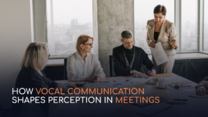 Image of a meeting with text overlay: How Vocal Communication Shapes Perception in Meetings